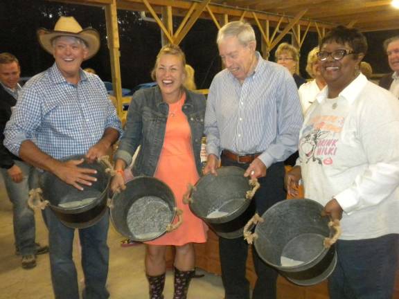 'Bountiful Harvest' event features cow-milking contest From left, 2015 cow milking celebrities Jimmy Smith of Advance Testing; Rachel Neuhaus, first lady of Orange County; Lou Heimbach, retired county executive; and Patricia Clairborne, former executive director, Cornell Cooperative Extension.