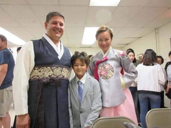 Korean Cultural Night dazzles the community Keith and Kathy Carpentier with son Ty (Photo by Ginny Privitar)