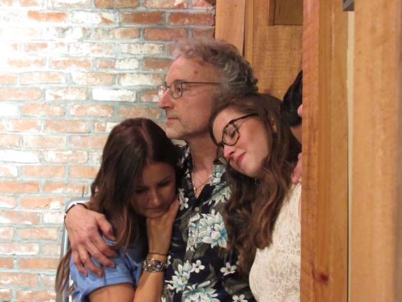 Suzy Fest is a community success Glenn Arnowitz and his daughters, Lisa and Kara, are seen listening to "The Mountain," sung by Suzy.