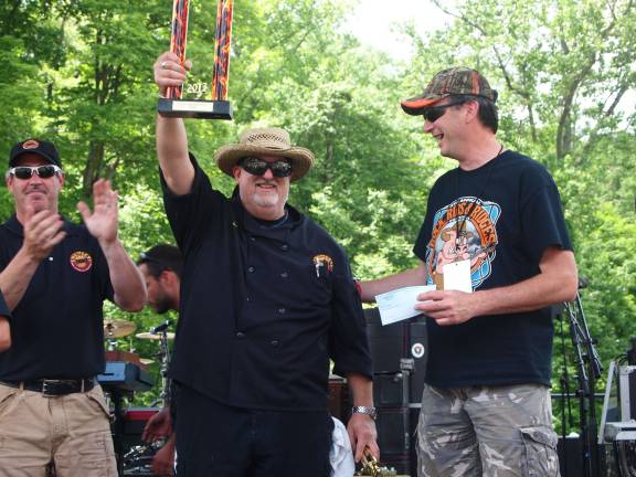 Chumley's BBQ claims 'Best Ribs' title Photo courtesy Russ Mensch/Mensch & Company, Inc. Chef Dan Lemire of Chumley’s BBQ & Catering Company (center) celebrating his team’s first place victory. He is flanked by Jason Gaer of Chumley's BBQ on the left and Claude Jaillet of Franklin Sussex Auto Mall on right.