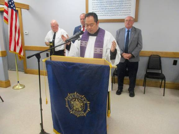 American Legion ceremony honors departed comrades Greenwood Lake American Legion Chaplain Father Reynor Santiago of St. Stephens starts the service with a prayer.