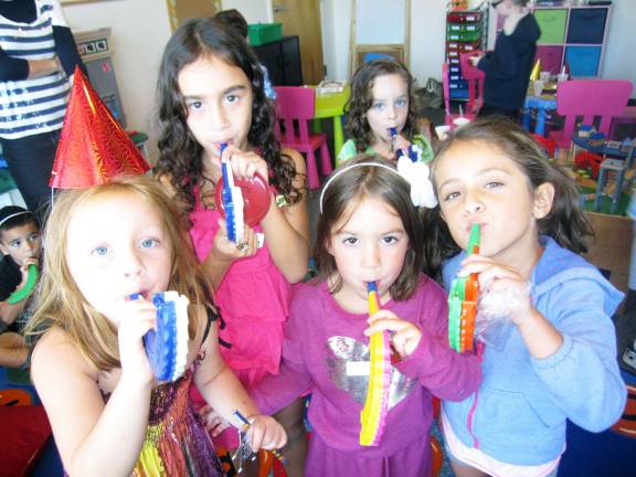 Chabad of Orange County announces High Holiday services and children’s programs Students of Chabad Hebrew Schoolís First Taste class (ages 5-6) learn to blow their own toy shofars. From left to right: Isabella Houck of Middletown, Rachel Murphy of Cornwall, Rivkah Burston, Sivan Kalkstien (in back) and Sammy Greenbaum, all of Monroe.