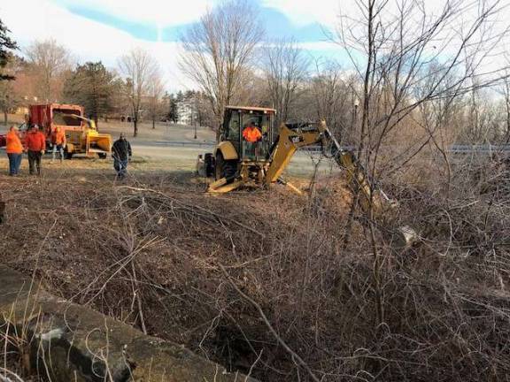 Eighteenth Century Warwick landmark cleaned On Jan. 15, Town of Warwick DPW crew members, using a combination of heavy equipment, hand tools and creative agility, managed to clear away the unsightly underbrush and give Warwick back it’s Old Stone Bridge. The bridge arches gracefully over the Wawayanda Creek, just south of Wickham Lake on the grounds Wickham Woods Park.