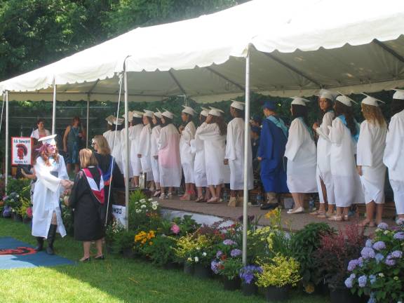 Hats off to the S.S. Seward Institute’s Class of 2013 Graduates received their diplomas from Karyn Meier, president of the Board of Education and Diane Munro, superintendent of schools.