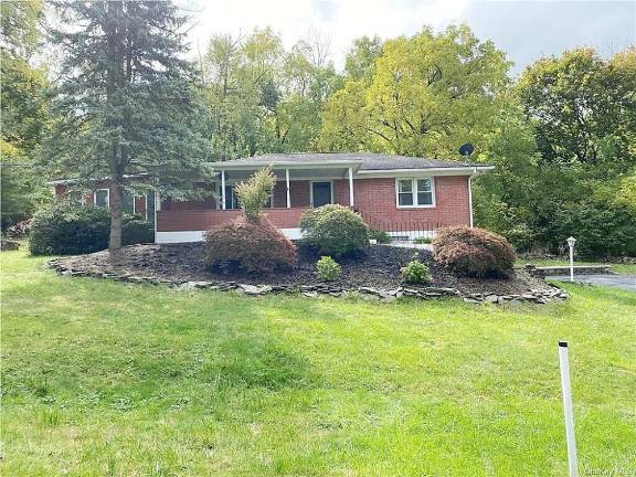 House on country road perched near village and outdoor recreation