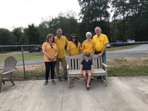 Warwick Lions Christine Adams, Michael Andersen, Erin Andersen, Kathy McManus and George McManus. Little Lion Nash Andersen tries out the new bench.