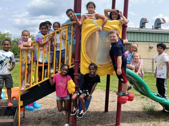 These youngsters pause in their play for the camera.