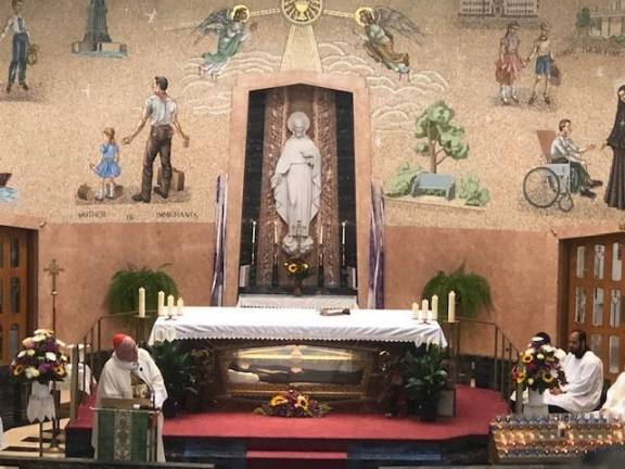 Cardinal Dolan: 'I pray that understanding, respect and love might grow in dealing with newcomers to our land' Provided photo Cardinal Timothy Dolan, the Archbishop of New York, celebrated Mass at the convent of Mother Saint Frances Cabrini, the patroness of immigrants and refugees, at her shrine in Washington Heights.