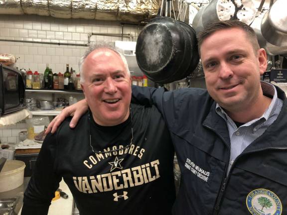 Shop small on Saturday and support local businesses Provided photo Orange County Executive Steven M. Neuhaus visited with Stephen Serkes, owner of Catherine’s Restaurant in Goshen in his efforts to promote Small Business Saturday this Saturday, Nov. 24.