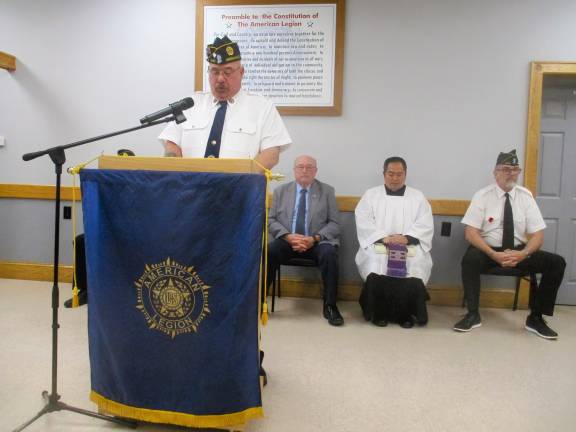 American Legion ceremony honors departed comrades Forner Commander Walter Kittle speaks of the significance of the missing soldier table