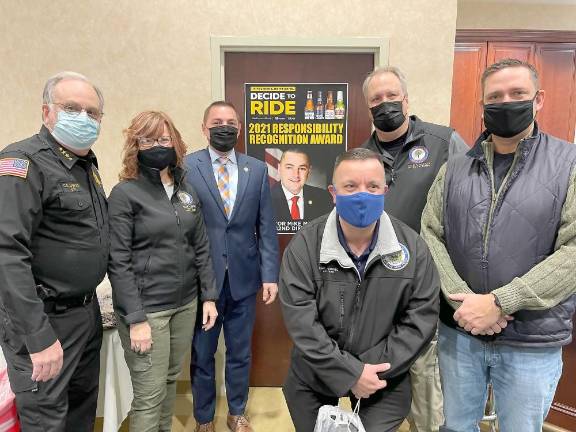 (From left right) Orange County Sheriff Carl E. DuBois, Deputy County Clerk Kelly Eskew, Senator Mike Martucci, Assemblyman Karl Brabenec, District Attorney David Hoovler and Orange County Executive Steven M. Neuhaus on Wednesday, December 29th Dana Distributors in Goshen.