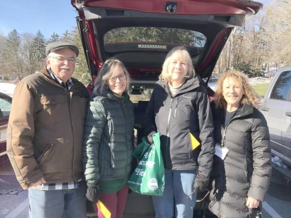Meals on Wheels brings meals and a little more Meals on Wheels of Warwick volunteers delivering blizzard bags to clients. L to R: Tom Cassidy, Barbara Mirra, Mary Ann Gallagher, Nikki DeLille