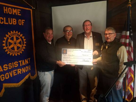 Rotary’s $2K donation to fight polio grows to $6K through the Bill and Melinda Gates Foundation Photo by Jim LaPlante Proceeds from Warwick’s Citizen of the Year Dinner have been donated to Rotary International’s effort to eliminate polio worldwide. Shown, left to right, are former Rotary presidents and Citizens of the Year Stan Martin and Leo Kaytes Sr.; PolioPlus representative Dr. David Kruger and Warwick Valley Rotary Club President Dave Eaton.