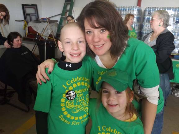 Celebrating St. Patrick's Day Sherri Kardos of Wantage, N.J. "Going green for charity. My son Brian, myself and my daughter Baylee after Brian shaved his head at the Sussex Fire Department St. Baldricks event March 15. This was his third time raising money for kids with cancer."