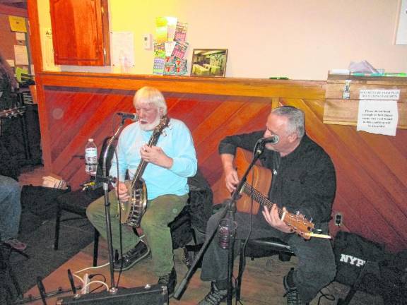 Don “Banjo” Smith, left, playing banjo along with John O’Boyle, who played guitar.