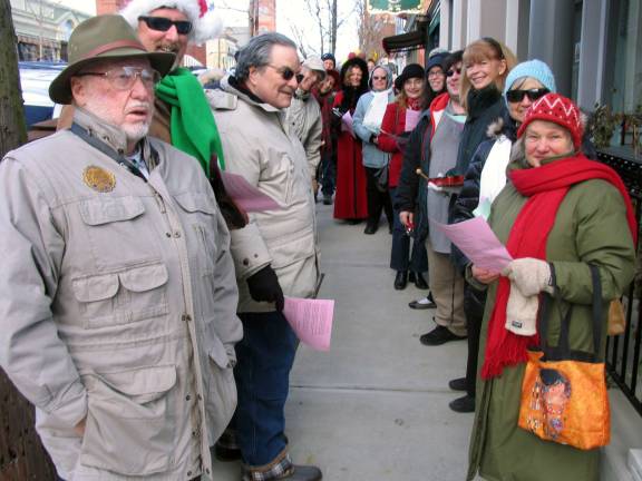 Shoppers braved the cold to be 'Home for the Holidays' Photos by Roger Gavan The Warwick Valley Chorale strolled along Main Street and Railroad Avenue, stopping at many of the shops and restaurants, singing traditional Christmas carols. Additional photos can be found online at warwickadvertiser.com.