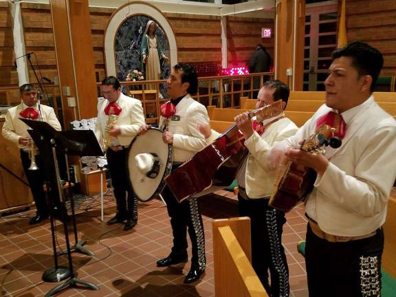 Spanish and English Mass at St. Stephen's honors Our Lady of Guadalupe Provided photos by Rocco Battista Liturgical music during the Mass was provided by the Mariachi band "Viva Mexico."