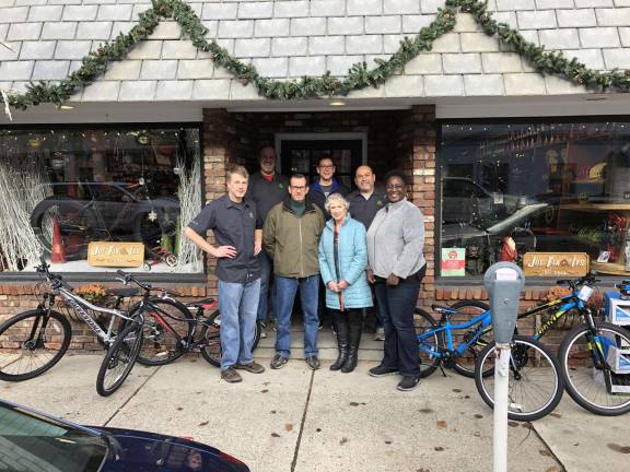 OC Bike Club, Joe’s Fix It’s and The Bicycle Doctor again remember needy children during the holiday season Photos provided At Joe Fix It’s, from the left: Dave Meland, Joe Fix It’s; Shaun Hamilton, Joe Fix It's; Don Karlewicz, club treasurer; Bill Stelz, club president; Peggy Cullen, club vice president; Brian Dunlevy, owner, Joe Fix It’s; and Sharon Williams, Big Brothers / Big Sisters executive director.