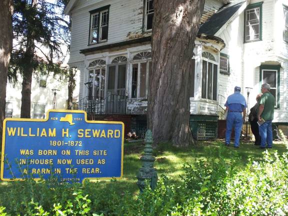 Florida group hopes to preserve Seward's birthplace Bob Scott, John Kimiecik and Joyce Willis outside the Mapes house which was built in the spot where the carriage house once stood. Seward was born in the structure converted to a carriagehouse and moved further back in pieces and then reconsturcted so the Mapes house could be built. (Photo by Vicky Botta)