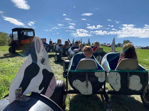 Take a ride on the whimsical “Cow Train” this Saturday at the Wright Family Farm in Warwick during Uncle Shoehorn’s Funky Corn Festival.