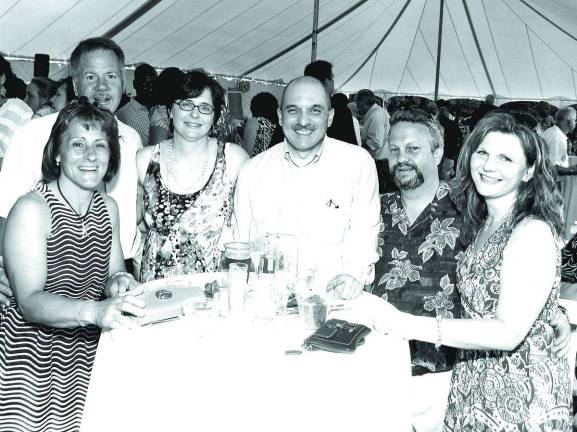 June Tent Party raises $52,000 From left, Janet and Terry Grahn, Mary and Dr. John Juliano with Dr. Kevin and Gerry Trapp.