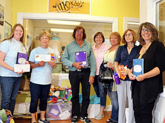 Back to School Drive a 'success' Photo by Roger Gavan From left, Backpack Snack Attack volunteer Laura Nokland; Director Shirley Puett; WTBQ station owner Frank Truatt; Maureen Major, CCO of Zylofone; WTBQ station manager Taylor Sterling; and Linda Martini and Beth Mindes of the Child Care Counsel of Orange County. Not pictured, Debbie Major, CEO of Zylofone.