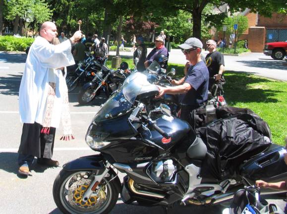 St. Stephens motorcycle blessing and ride a success from start to finish The Rev. Angelo Micciulla, pictured here, and the Rev. Michael McLoughlin blessed each motorcycle individually. There were about 80.