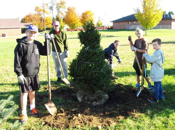 Of scouts and trees Photo provided by Kerry Danaher Boy Scouts from Troop 38 planted trees at the Pine Island Firehouse on Sunday, Oct. 21. From left to right are: Egan Danaher (holding shovel), Rob Pierce (a dad), Jacob Burghardt, Billy Wilke and Thomas Rampe.