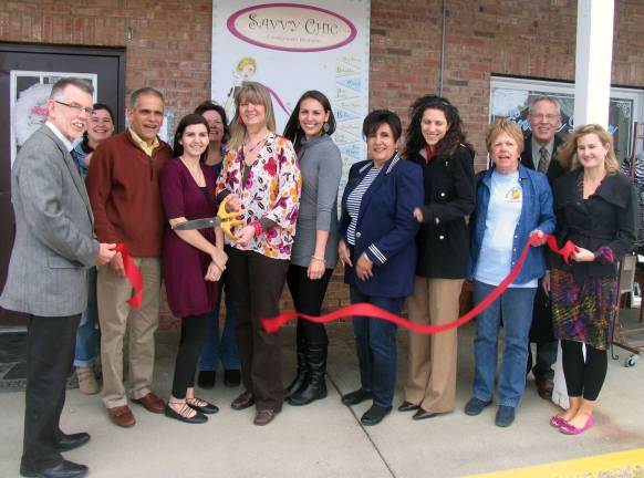 Savvy Chic celebrates grand opening and under new management On Thursday, March 20. Town of Warwick Supervisor Michael Sweeton (far left) and members of the Warwick Valley Chamber of Commerce joined Joanna Barbuto (center), her family and several clients for a ribbon cutting ceremony to officially celebrate the new management at Savvy Chic.