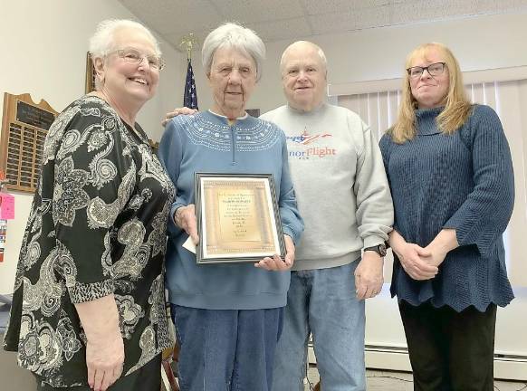 The Seward Seniors recently presented Marion Kowalyk with a Certificate of Appreciation for the services she has rendered to the group. As the Seward Seniors' Executive Financial Officer for many years, she was entrusted with the collection and disbursements of the group's funds and providing written reports of all financial activities. Pictured from left to right are: Rosemary Matthews, president; Marion Kowalyk, honoree; Steve Maher, vice president; and Linda Kuszek, secretary.