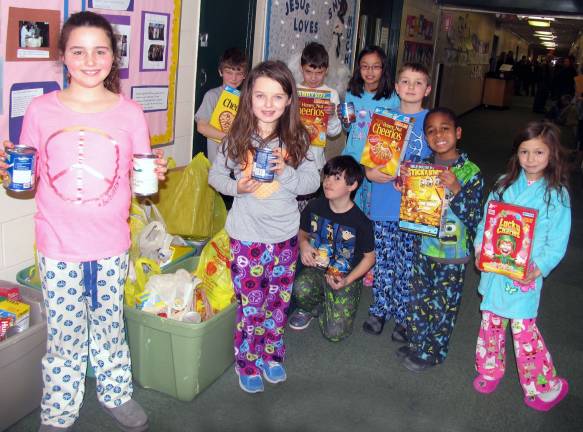 St. Stephen - St. Edward School celebrates National Catholic Schools Week Photos by Roger Gavan On Tuesday, þÄúpajama day,þÄù all of the students were asked to bring an item of non-perishable food to be distributed to the Warwick Ecumenical Council Food Pantry.