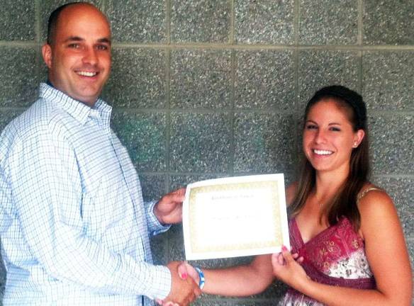 Morgan Thonus and Matthew Ulrich awarded $1,000 Robert F. Helmrich Memorial scholarships Steve Helmrich congratulates Morgan Thonus as one of the two recipients of $1,000 Robert F. Helmrich Memorial Scholarships.