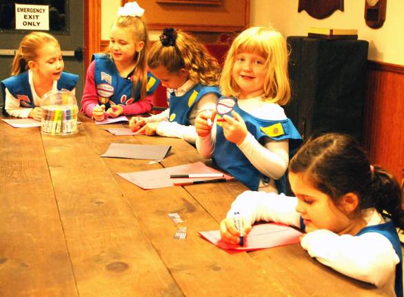 From young to old: Thanks Photo by Ed Bailey Members of Girl Scouts Daisy Troop #104 write and illustrate notes and cards to give to the members of Warwick VFW Post 4662 as part of an early Thanksgiving meal last Tuesday.