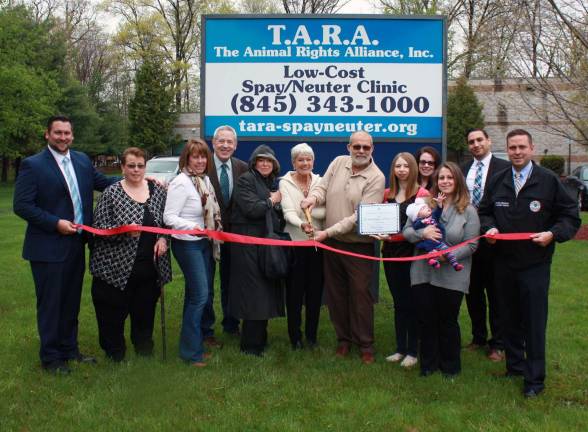The Animal Rights Alliance continues to make difference in pet overpopulation Photo provided by Bea Arner /of the Warwick Valley Chamber of Commerce Representitives from the Town of Wallkill, the Warwick Valley Chamber of Commerce and Orange County joined The Animal Rights Alliance for a ribbon-cutting celebrating the two-year anniversary of their stationary clinic in Middletown. From left to right: Wallkill Supervisor Daniel Depew, Wallkill Town Clerk Louisa Ingrassia, Warwick Chamber President Mechelle Casciotta, Chamber Executive Director Michael Johndrow, Chamber board member Taylor Sterling, co-founders Rose and Stephen Tardif, TARA Office Manager Annemarie Forgie, Greater Hudson Bank Branch Manager and Warwick Valley Chamber of Commerce Executive Board member Susan Ronga, Greater Hudson Bank Branch Manager Robert Meighan, District Office Manager of Karl Brabenec Suzanne Edzenga, and Orange County Executive Steven Neuhaus.