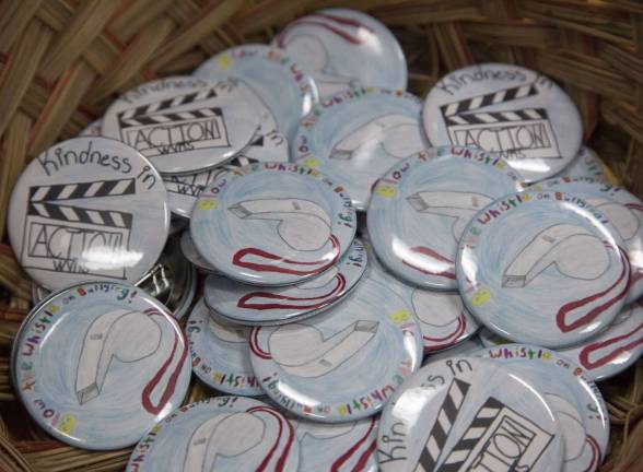 Superintendent’s Spotlight Maryjane’s and Elaina’s winning designs were made into buttons for No Name-Calling Week at Warwick Valley Middle School. Maryjane designed the “Kindness in Action” button; Elaina designed the “Blow the Whistle on Bullying” button.