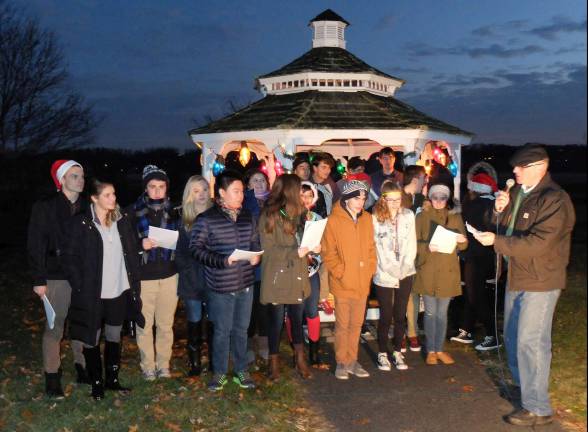 Provided photo Pine Island Chamber of Commerce President Leonard DeBuck joins the Meistersingers for a holiday tune or two.