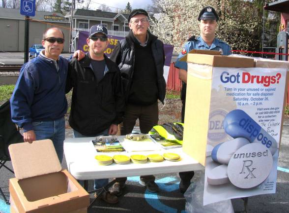Warwick swept clean A þÄúpill dropþÄù organized by the Warwick Valley Coalition in cooperation with the Warwick Police Department and the Drug Enforcement Administration (DEA) collected approximately 100 pounds of unused prescription and over the counter medications. From left, Steve Grandinali, Darnell Corti, School Board Liason Bob Howe and Warwick Police Officer Steve Helmrich.
