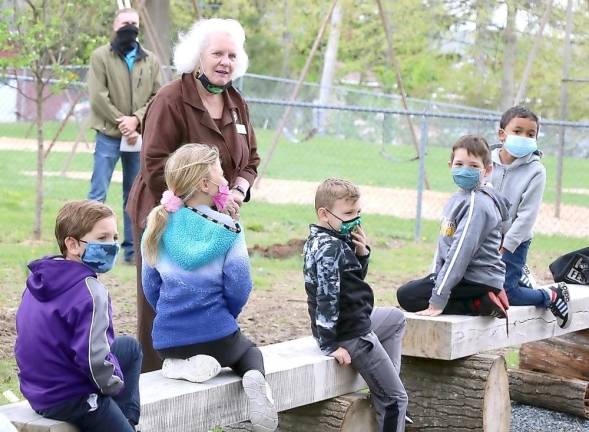 Guest speaker Patricia Reinhardt, chair of the Arbor Day Committee, a former schoolteacher and member of the Warwick Valley Gardeners, asked the children to name some benefits that we receive from trees. The variety of all correct answers included fresh air, a home for birds and animals, paper, houses, beauty and shade.