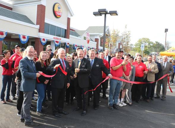 Warwick ShopRite celebrates completion of renovation with ribbon cutting Photo by Roger Gavan On Saturday, Oct. 7, state, county and local officials along with members of the Warwick Valley Chamber of Commerce joined company executives and staff to celebrate the grand re-opening with a ribbon-cutting ceremony. Store Manager Charlie Sladek (center) joined by Company President Brett Wing (left) and District Manager Rich Martin (right) cuts the ribbon held by Warwick Mayor Michael Newhard (far left) and Town of Warwick Deputy Supervisor James Gerstner (far right).