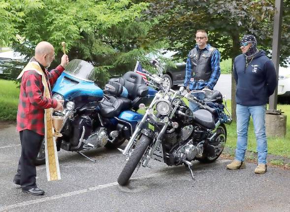 St. Stephen’s pastor, the Rev. Jack Arlotta, blessed each of the bikes individually.