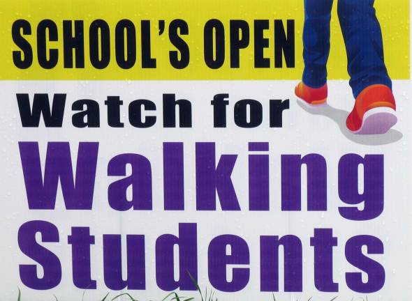 Walking to school - like the old days This is a close-up of one of the signs posted near Park Avenue School in Warwick.