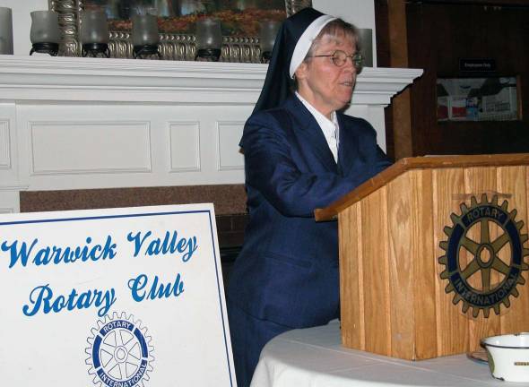 Rotarians support Garden of Child with 25 consecutive yearly donations Photo by Stan Martin Garden of the Child founder Sister Anna Roche accepts the organizationþÄôs 25th annual contribution from the Warwick Valley Rotary Club. Leo Kaytes helped promote the start-up efforts in 1989 when he was Rotary president. Since then Warwick Rotarians have donated more than $25,000 to Garden of the Child.