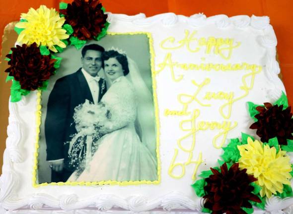 Jerry and Lucy Fischetti celebrate 64th anniversary at Warwick Seniors Club During the celebration the couple cut a special anniversary cake featuring a photograph taken on their wedding day 64 years ago.