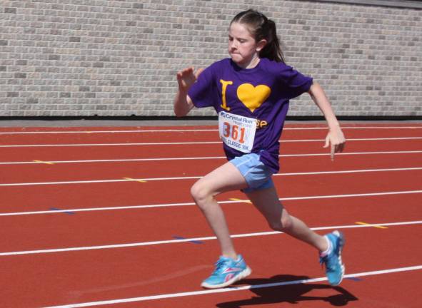 1,308 laps, 327 miles, 66 Middle School runners Lauren Fox and Mairead Mulvihil (pictured here) represented the Warwick Valley Middle School Mileage Club at the Jr. Classic Race in Middletown on June 2.