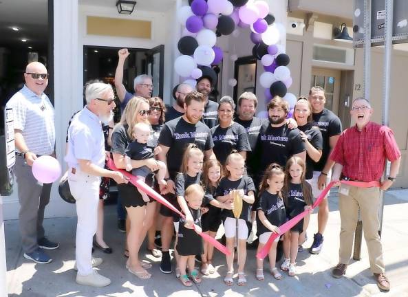 Warwick. Tank Masters Environmental, Inc. opens new office in Village of Warwick On Wednesday, June 30, Town of Warwick Supervisor Michael Sweeton (right), Mayor Michael Newhard (left) and members of the Warwick Valley Chamber of Commerce joined owner Brian Monahan, his family and staff to celebrate the opening of the company’s new office at 16 Main St. in the Village of Warwick. Monahan’s granddaughter Elliana Herrmann, 8, had the honor of cutting the ribbon. Photo by Roger Gavan.