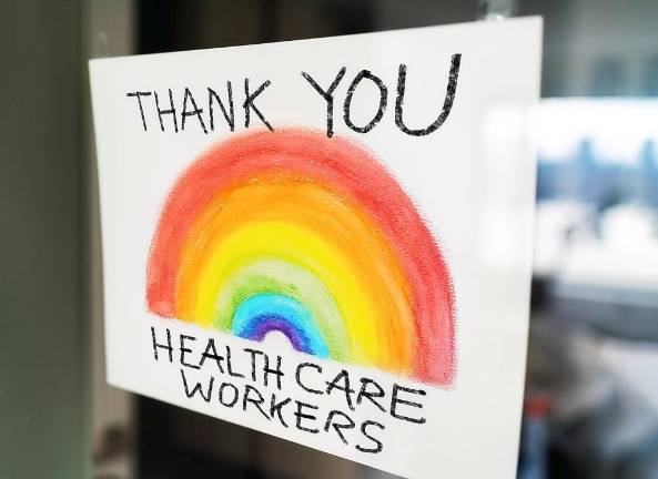 Goshen. County Executive launches ‘Orange Cares’ program Healthcare workers child's painting hanging at window as appreciation support message for doctors and nurses fighting COVID-19 at hospitals.