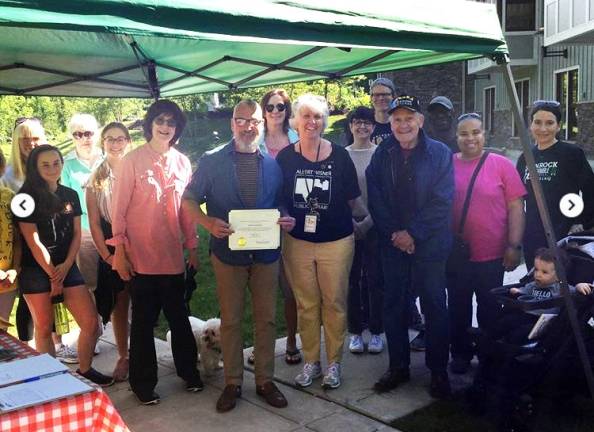 Warwick Family Fun Walk first event in celebration of new Wisner Library's 10th anniversary Provided photo Friends of the Library members Norman Isaacson and Mary Berrigan look on as Mayor Michael Newhard presents Library Director Rosemary Cooper with a certificate in honor of the 10th anniversary of the Albert Wisner Public Library's new facility at One McFarland Drive in the Village of Warwick.