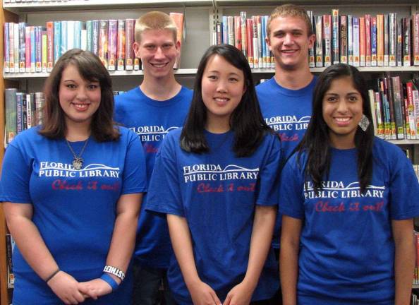 Turning of the pages at the Florida Public Library Pages at the Florida Public Library, pictured here from left to right, are: Jade Vi‡±as, Caleb Pawelski, Wei Lynn Ng, Brandon Codi and Kayla Campa‡±a.