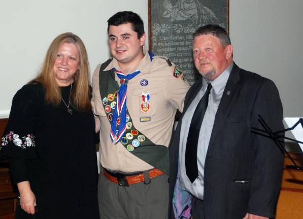 Shea Gormley rises to the rank of Eagle Scout GREENWOOD LAKE. Troop 477 scout planned, designed and led the construction of three large benches with planters sat Ben Winstanley Park. Photos by Ed Bailey Troop 477 Eagle Scout Shea Gormley with his parents Unateresa and Sam Gormley during his Honor Court ceremony May 18 at Grace Evangelical Lutheran Church in Greenwood Lake.
