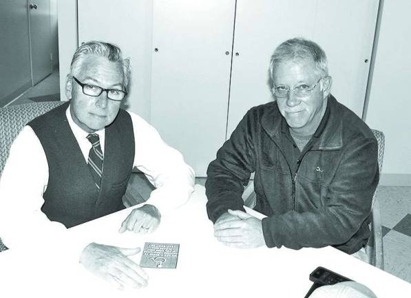 Warwick merchants asked to participate in program for the disabled Photos by Roger Gavan From left, Mayor Michael Newhard meets with Building Inspector Dan Kelly to discuss the new voluntary program to benefit the disabled.